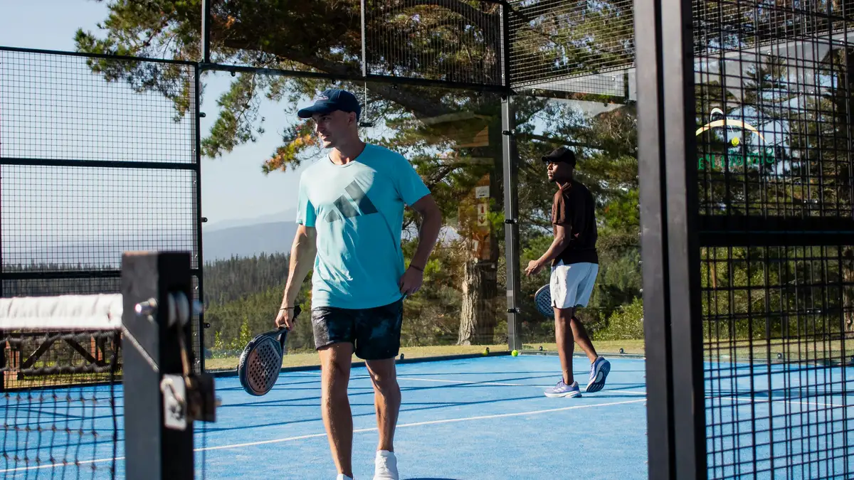 Padel court with glass walls and a net